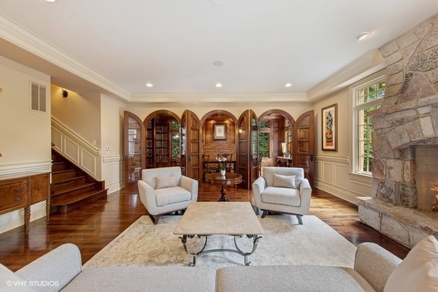 561 Walker Road Hinsdale, IL 60521 - Photo 12 of 41 a living room with fireplace furniture and a painting on the wall
