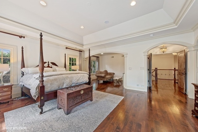 561 Walker Road Hinsdale, IL 60521 - Photo 19 of 41 a bedroom with a bed and wooden floor