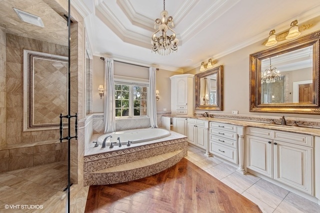 561 Walker Road Hinsdale, IL 60521 - Photo 20 of 41 a spacious bathroom with a tub sink and mirror