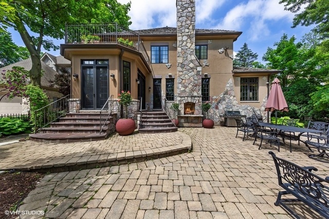 561 Walker Road Hinsdale, IL 60521 - Photo 35 of 41 a view of a house with sitting area and garden
