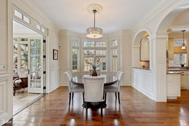 561 Walker Road Hinsdale, IL 60521 - Photo 9 of 41 a view of a dining room with furniture wooden floor and a chandelier