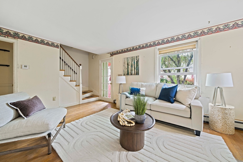 34 Wayburn Road Boston, MA 02130 - Photo 11 of 35 a living room with furniture and a large window