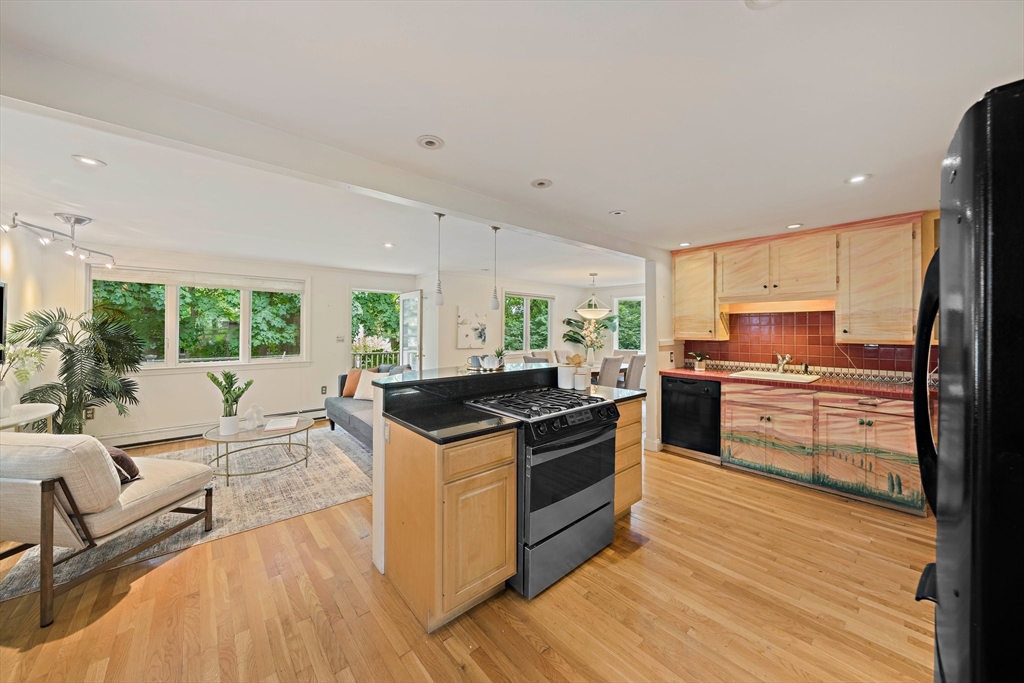 34 Wayburn Road Boston, MA 02130 - Photo 12 of 35 a kitchen with a stove a sink and a refrigerator