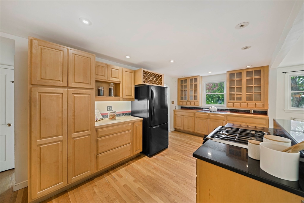 34 Wayburn Road Boston, MA 02130 - Photo 14 of 35 a kitchen with stainless steel appliances granite countertop a refrigerator stove top oven and sink