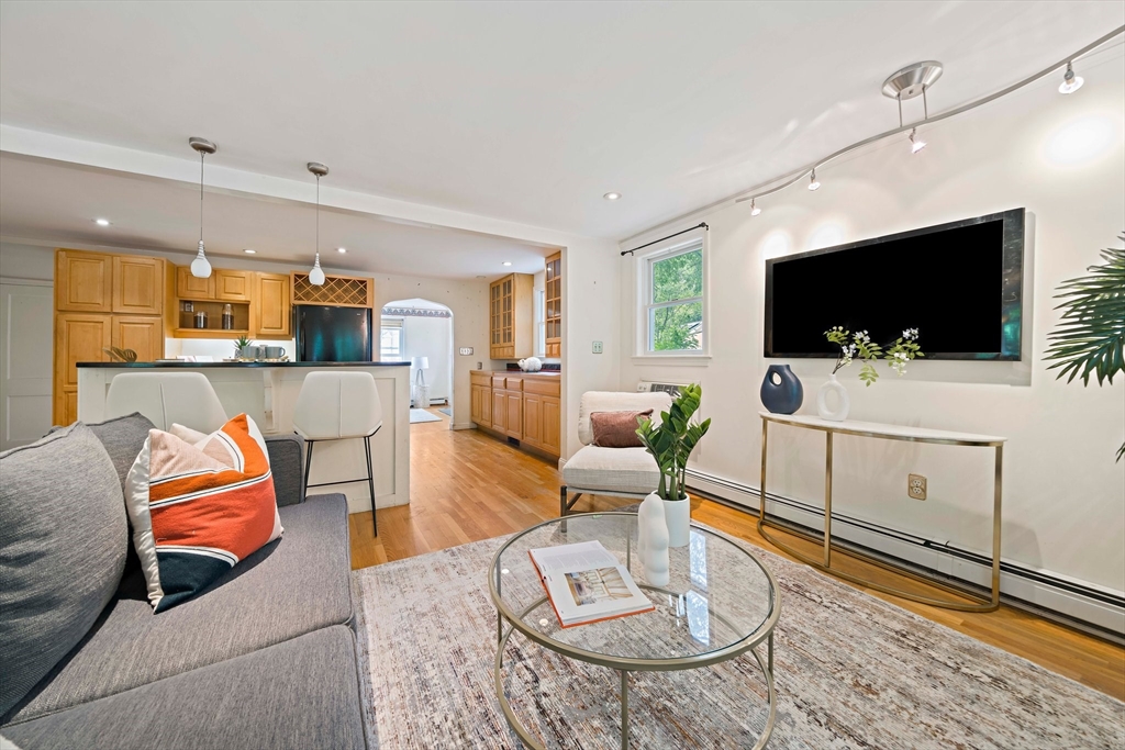 34 Wayburn Road Boston, MA 02130 - Photo 18 of 35 a living room with furniture and a flat screen tv