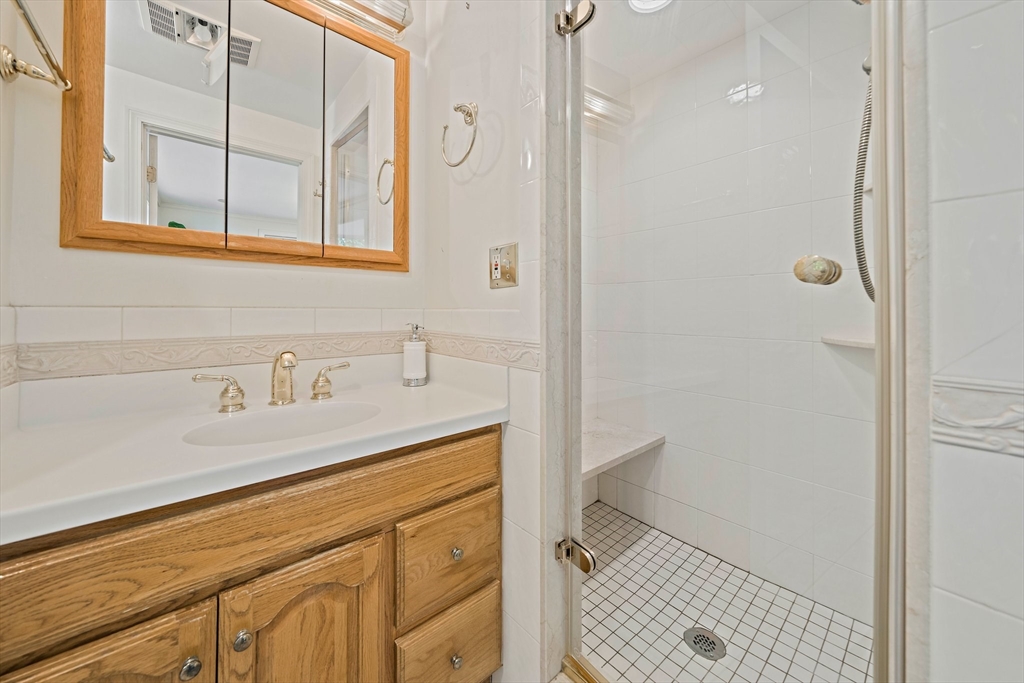 34 Wayburn Road Boston, MA 02130 - Photo 23 of 35 a bathroom with a sink a toilet and shower