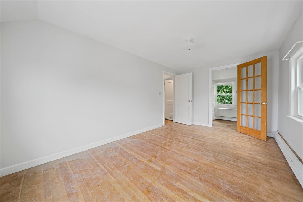 34 Wayburn Road Boston, MA 02130 - Photo 27 of 35 wooden floor in an empty room with a window