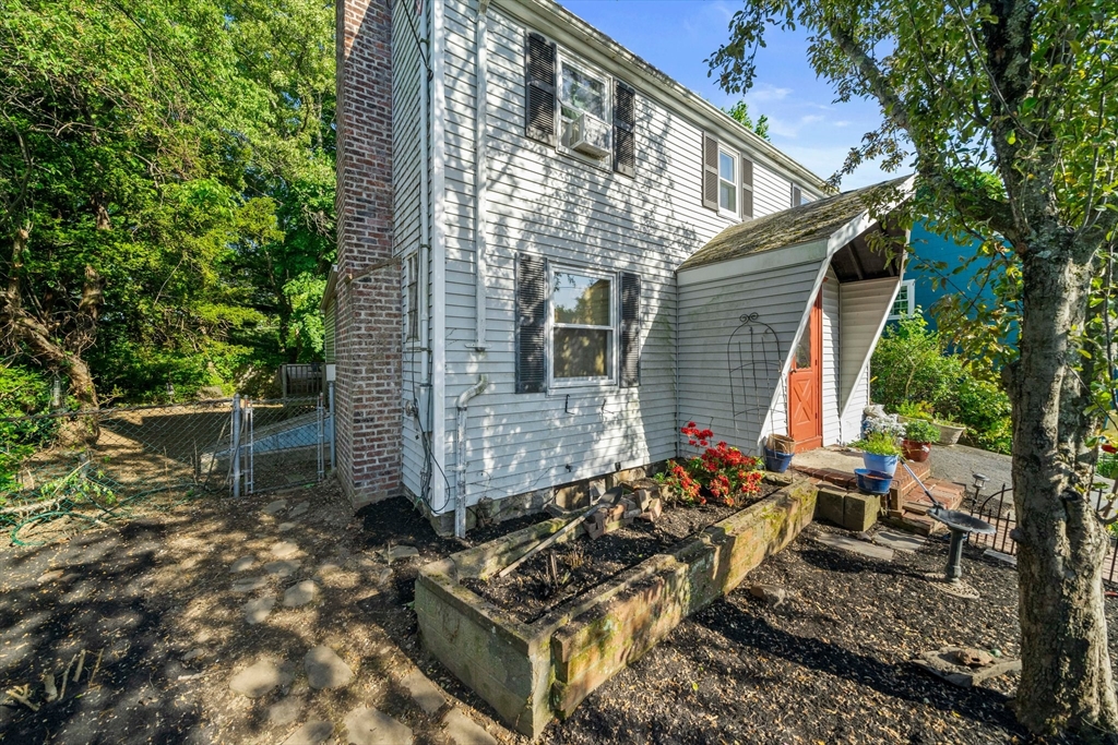 34 Wayburn Road Boston, MA 02130 - Photo 3 of 35 a backyard of a house with outdoor seating