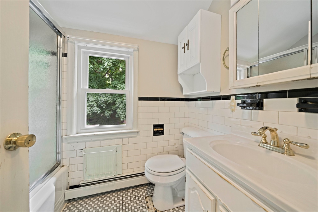 34 Wayburn Road Boston, MA 02130 - Photo 31 of 35 a bathroom with a sink toilet and shower