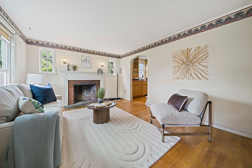 34 Wayburn Road Boston, MA 02130 - Photo 9 of 35 a living room with furniture and a fireplace