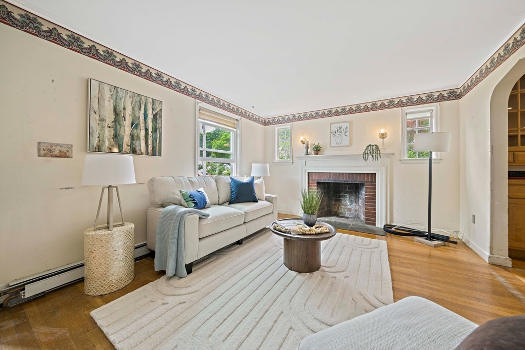 34 Wayburn Road Boston, MA 02130 - Photo 10 of 35 a living room with furniture and a fireplace