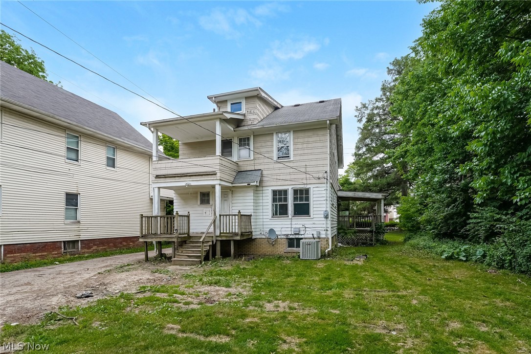 4586 Turney Road Cleveland, OH 44105 - Photo 15 of 16 Back of property with a yard and central AC unit