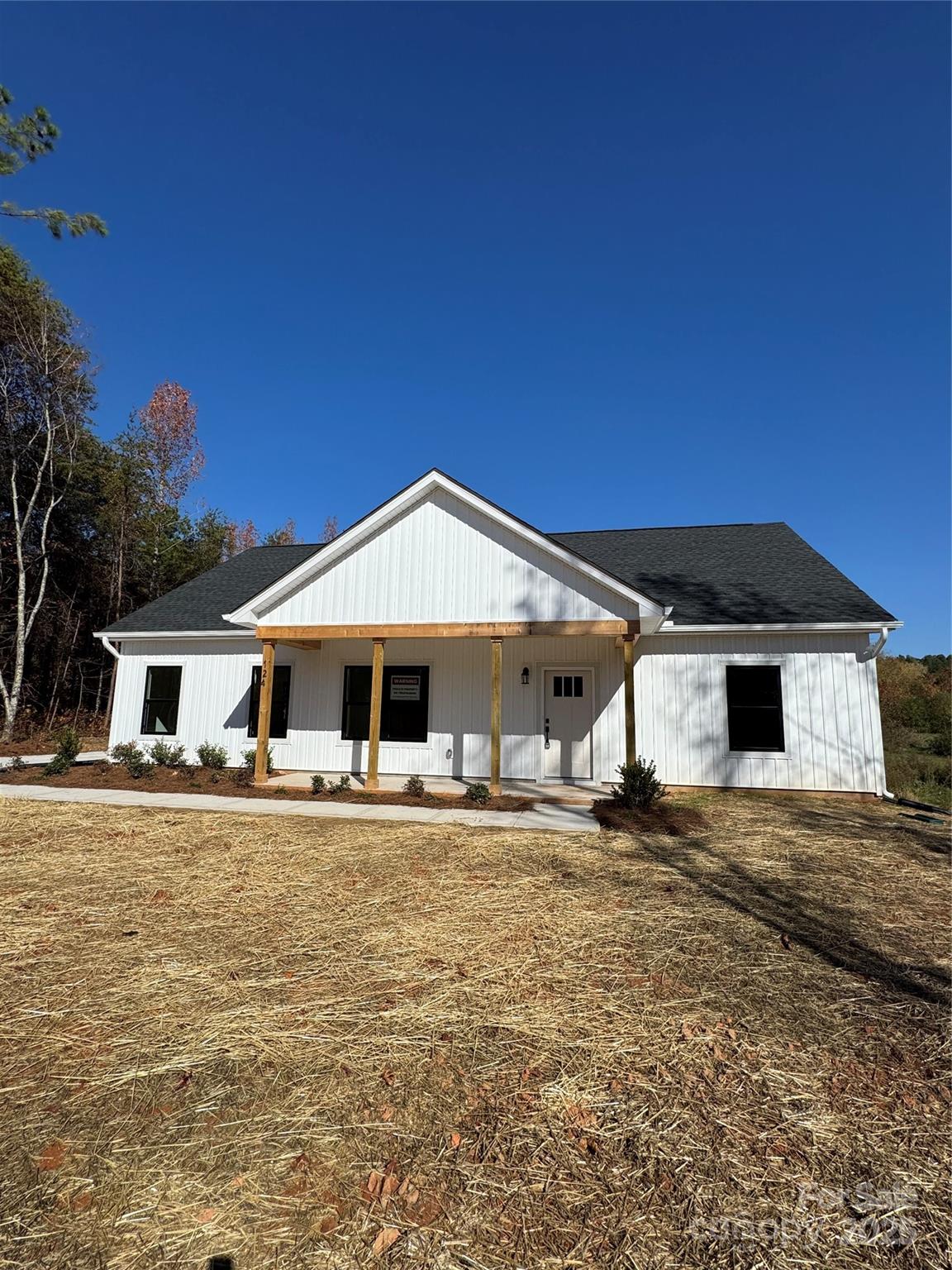 124 Rollingbrook Road Kings Mountain, NC 28086 - Photo 1 of 3 a house with trees in front of it