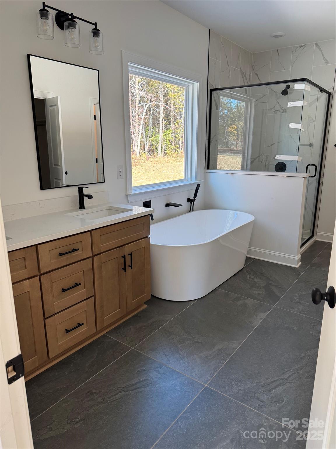124 Rollingbrook Road Kings Mountain, NC 28086 - Photo 3 of 3 a bathroom with a double vanity sink mirror and bathtub