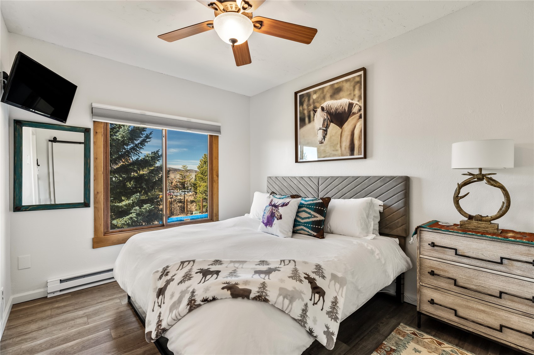 1945 Cornice Road, Unit 2224 Steamboat Springs, CO 80487 - Photo 11 of 22 Bedroom featuring ceiling fan, baseboard heating, and dark wood-type flooring