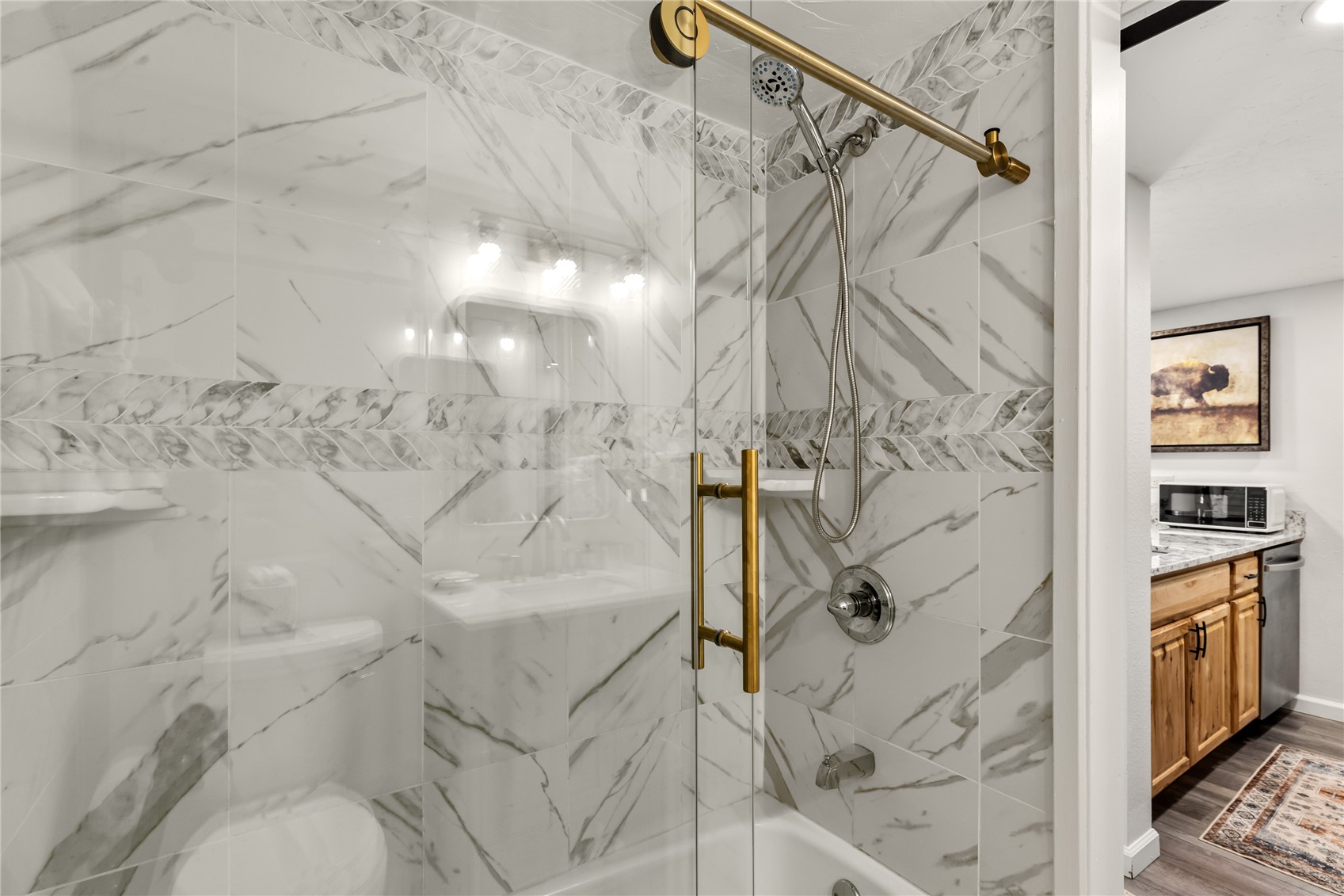 1945 Cornice Road, Unit 2224 Steamboat Springs, CO 80487 - Photo 15 of 22 Bathroom featuring vanity, hardwood / wood-style flooring, and enclosed tub / shower combo