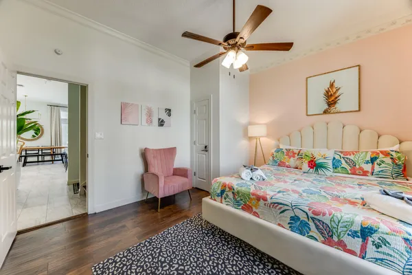 a living room with furniture and wooden floor