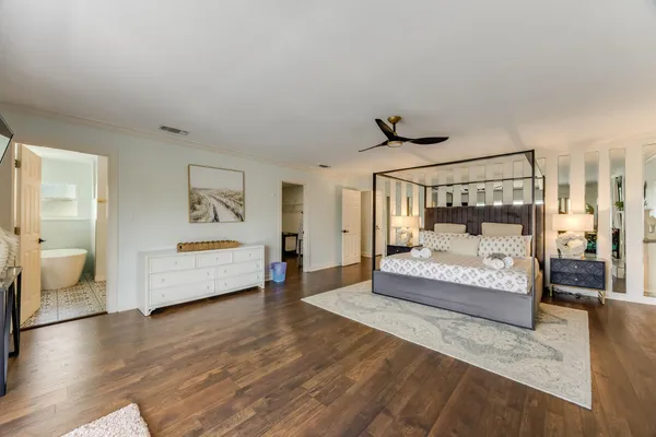a view of a patio with table and chairs