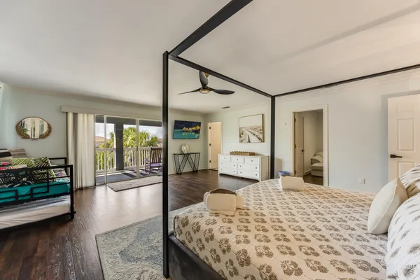 a view of a livingroom with furniture and floor to ceiling window