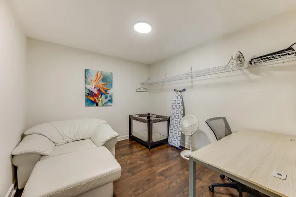 a view of a chair and tables in the balcony