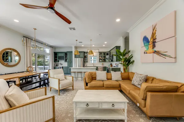 a front view of a house with swimming pool and outdoor seating