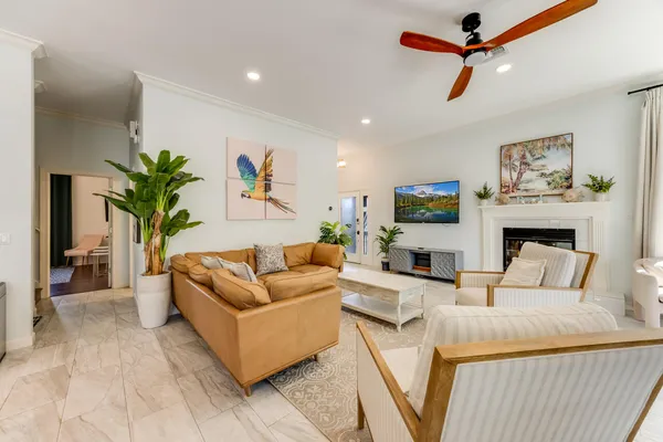 a kitchen with stainless steel appliances granite countertop a stove a sink a oven a dining table and chairs