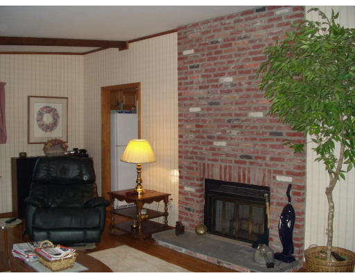 114 Powder Mill Road Sudbury, MA 01776 - Photo 3 of 7 a living room with furniture and a fireplace