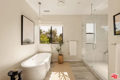 a bathroom with a toilet sink and shower