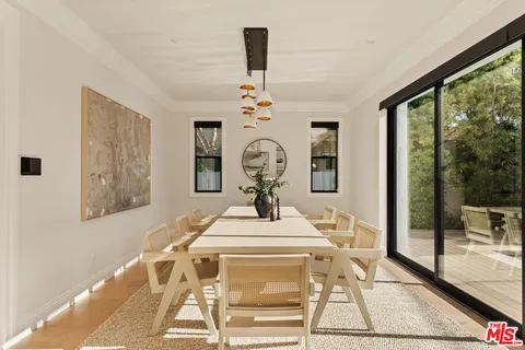 a view of hall way with furniture