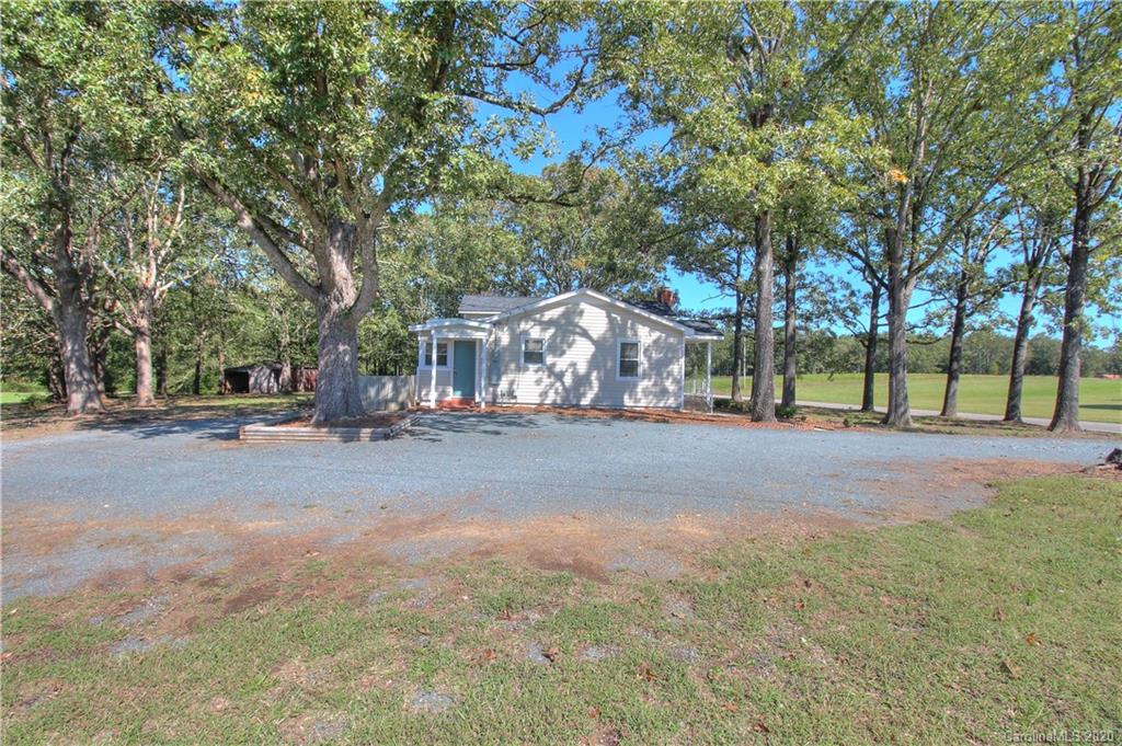 7116 Wolf Pond Road Monroe, NC 28112 - Photo 22 of 22 a view of road with trees
