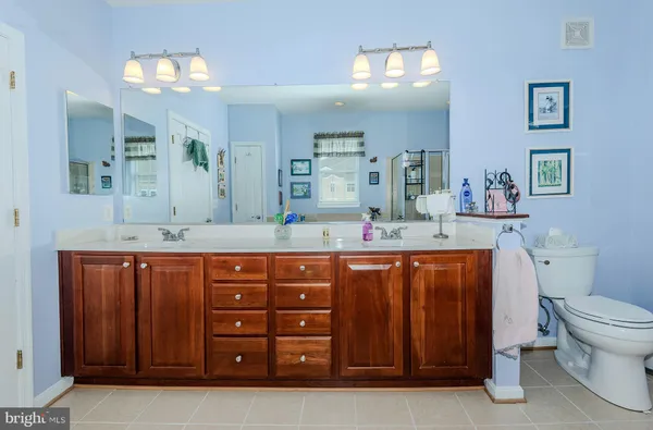 a white bath tub sitting next to a white sink