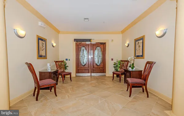 a living room with furniture and a chair