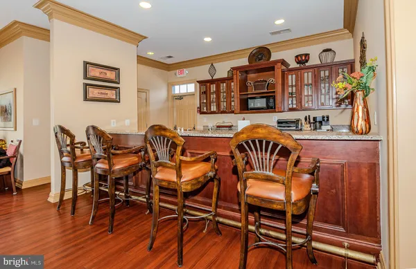 a kitchen with stainless steel appliances granite countertop a sink and cabinets