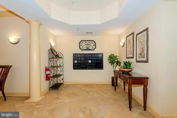 a view of a livingroom with furniture and a window