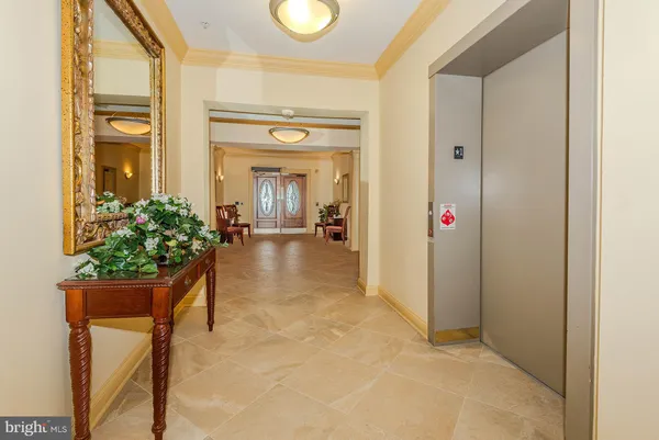 a view of a livingroom with furniture and a bedroom