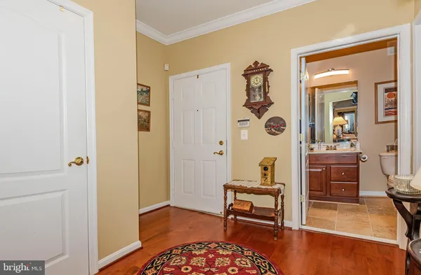 a bathroom with a sink a toilet a mirror and shower curtain
