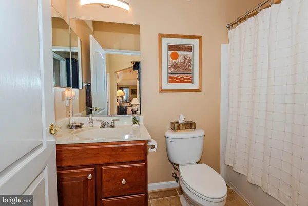 a living room with furniture or couch and a large window