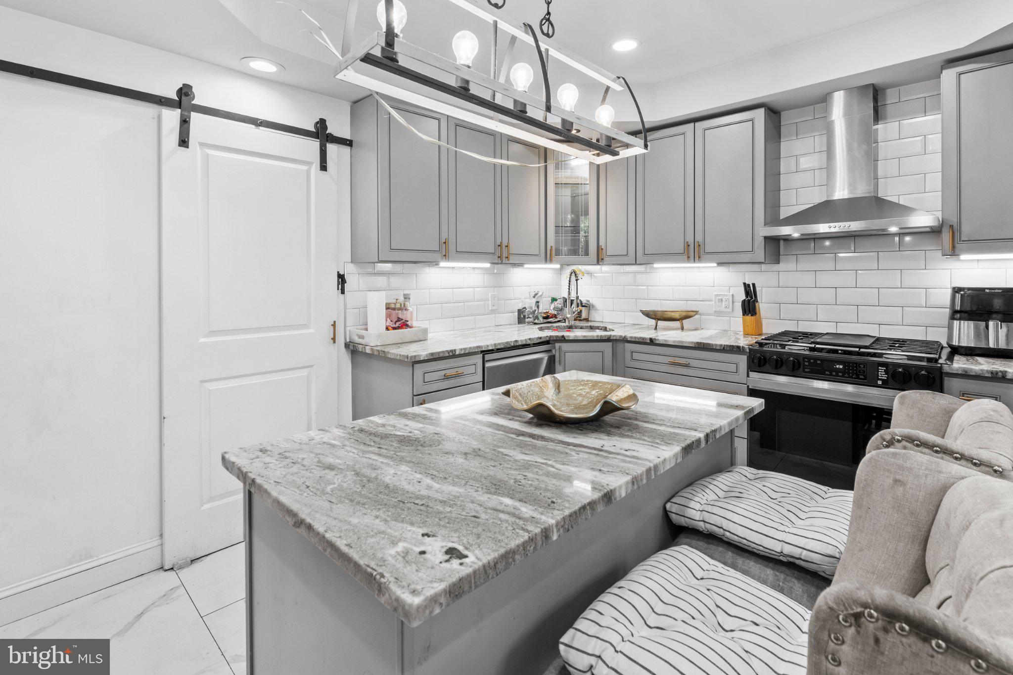 242 Church Road Elkins Park, PA 19027 - Photo 9 of 29 Sleek modern kitchen with elegant finishes.