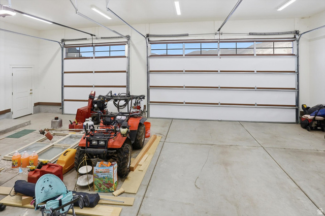 534 East Fish Hatchery Road Mantua, UT 84324 - Photo 60 of 87 Garage featuring a garage door opener