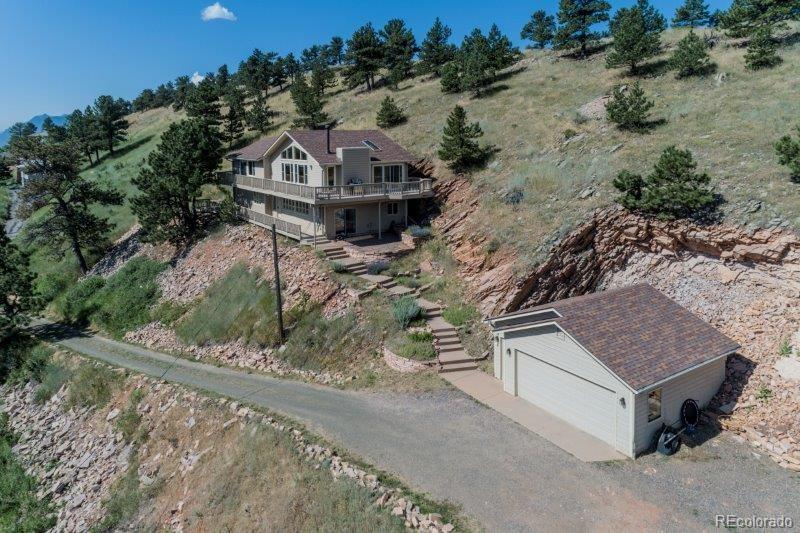 6513 Red Hill Road Boulder, CO 80302 - Photo 1 of 32 an aerial view of a house with a yard