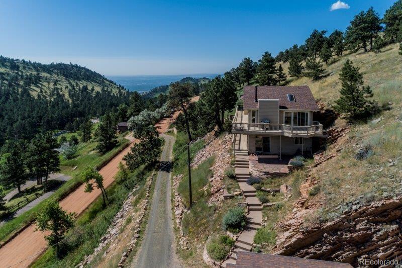 6513 Red Hill Road Boulder, CO 80302 - Photo 2 of 32 a view of a house with a yard