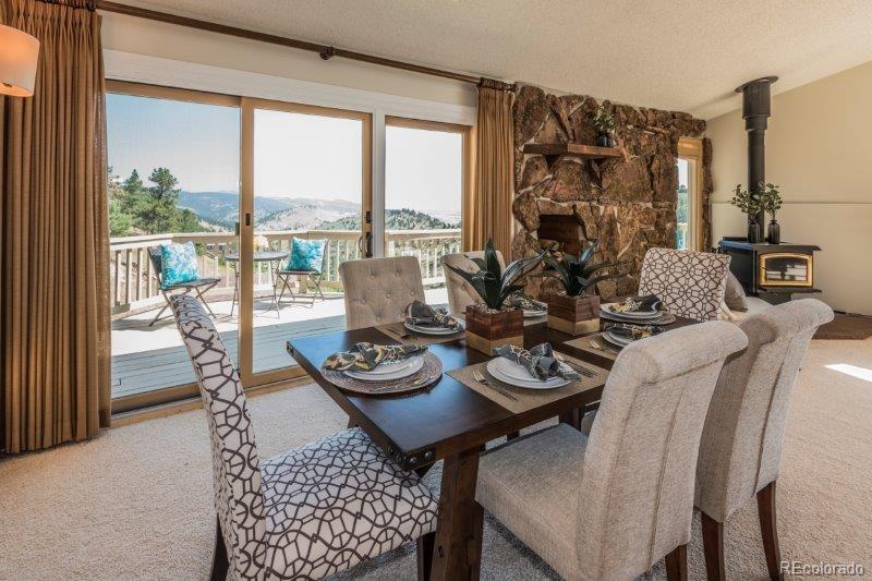 6513 Red Hill Road Boulder, CO 80302 - Photo 8 of 32 a view of a dining room with furniture window and outside view