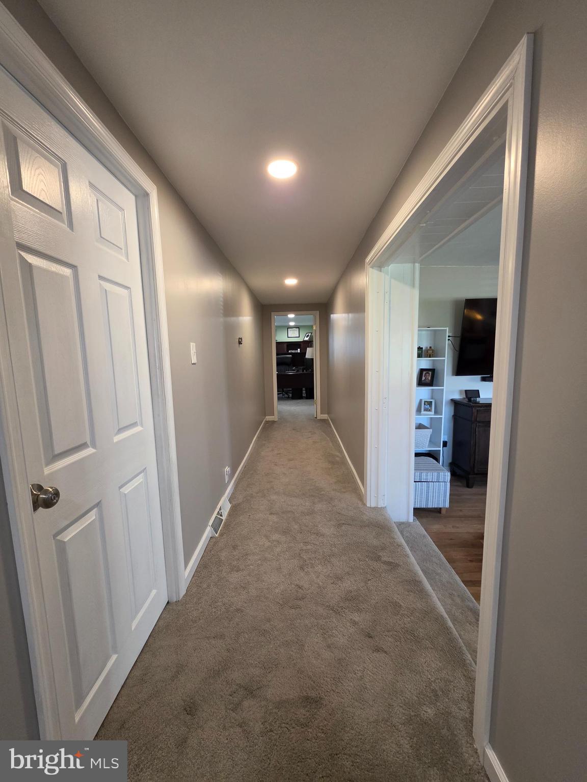 142 New Road Horsham, PA 19044 - Photo 18 of 38 a view of a hallway with wooden floor and a kitchen