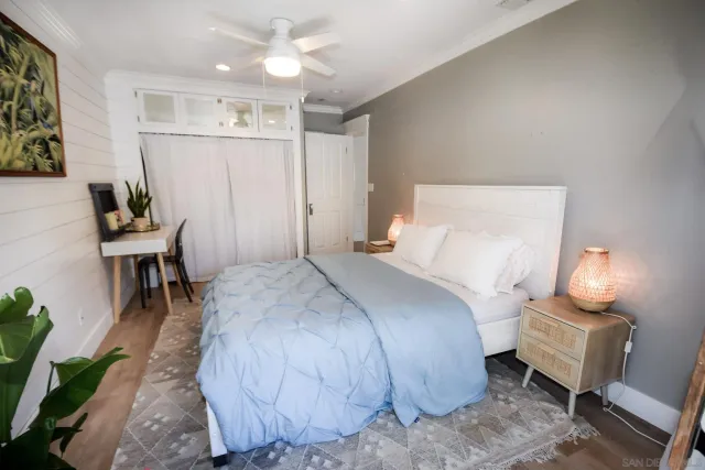 a bed room with a bed and a chair