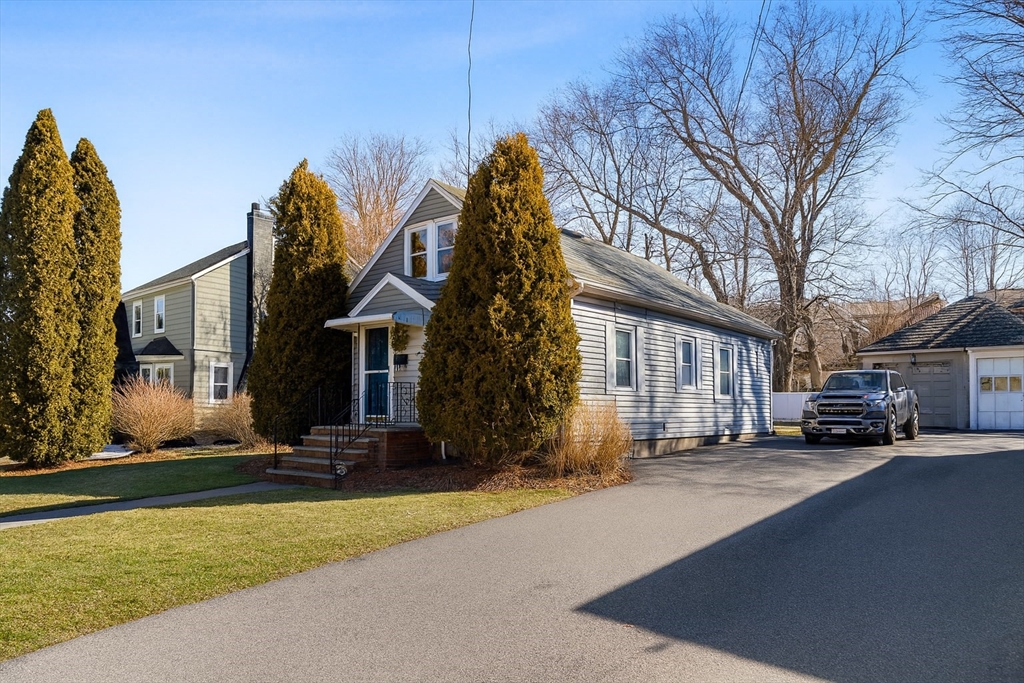 a front view of a house with a yard