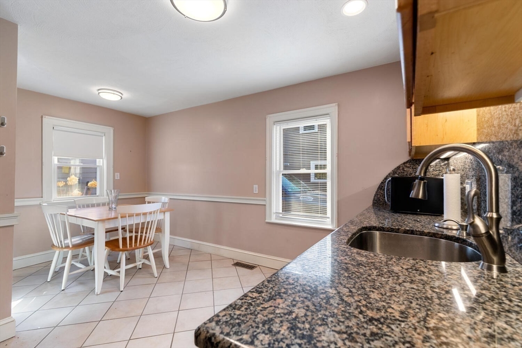 9 Wildwood Road Medford, MA 02155 - Photo 17 of 38 a kitchen with a sink a table and chairs
