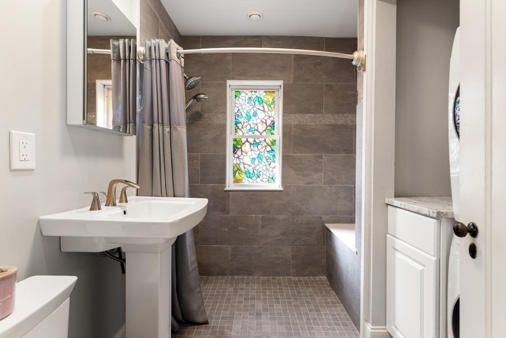 9 Wildwood Road Medford, MA 02155 - Photo 21 of 38 a bathroom with a sink a toilet and shower