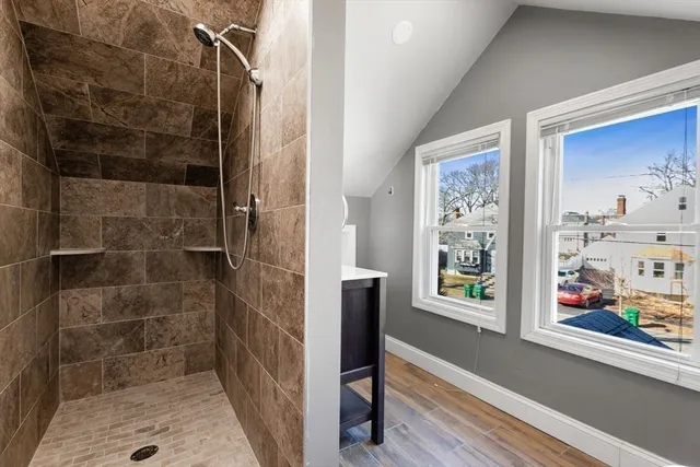 a bathroom with a bathtub and a shower