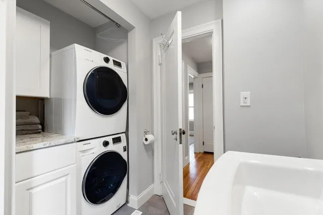 a view of a bedroom with washer and dryer