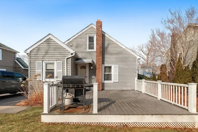a view of a house with wooden fence